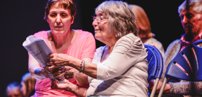 Dementia patient with family member enjoying music