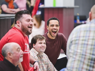 The cast laugh in a rehearsal