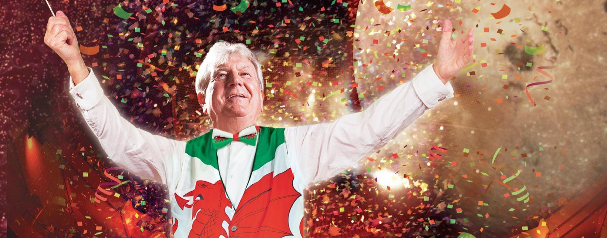 Welsh Proms 2019 Poster shows a male conductor dresses in a red, white and green waistcoat, with planets, balloons and Welsh flags.