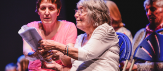Dementia patient with family member enjoying music