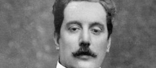 A headshot of famous composer Puccini. 