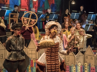 WNO Brundibar Josh Stanbury Policeman Sophie Perry Ice cream man WNO Youth Opera Photo credit Johan Persson 00235